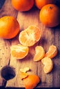 Vintage photo of fresh tangerines on wooden cutting board Royalty Free Stock Photo