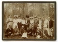 Vintage photo of the group of people in the forest