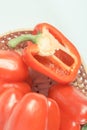 Vintage photo, Heap of red peppers in wicker basket on white background, concept of healthy nutrition Royalty Free Stock Photo