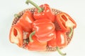 Vintage photo, Heap of red peppers in wicker basket on white background, concept of healthy nutrition Royalty Free Stock Photo