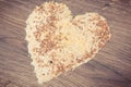 Vintage photo, Heart shaped groats, amaranth, brown rice and quinoa seeds, healthy food concept