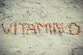 Vintage photo, Inscription vitamin D on sand at beach, summer time and healthy lifestyle