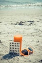 Vintage photo, Medical pills, carrot juice and sunglasses on sand at beach, vitamin A and beautiful, lasting tan Royalty Free Stock Photo