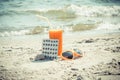 Vintage photo, Medical pills, carrot juice and sunglasses on sand at beach, vitamin A and beautiful, lasting tan Royalty Free Stock Photo