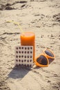 Vintage photo, Medical pills, carrot juice and sunglasses on sand, vitamin A and beautiful, lasting tan Royalty Free Stock Photo