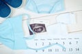 Vintage photo, Pregnancy test, ultrasound scan of baby, clothing for baby Royalty Free Stock Photo