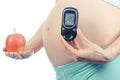 Vintage photo, Pregnant woman with glucometer and apple, diabetes and healthy nutrition during pregnancy Royalty Free Stock Photo