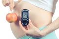 Vintage photo, Pregnant woman with glucometer and apple, diabetes and healthy nutrition during pregnancy Royalty Free Stock Photo