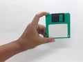 Vintage Photo Realistic Small Electronic Magnetic Floppy Disk for Old Computer Data Storage in White Background