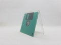 Vintage Photo Realistic Small Electronic Magnetic Floppy Disk for Old Computer Data Storage in White Isolated Background