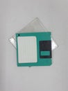 Vintage Photo Realistic Small Electronic Magnetic Floppy Disk for Old Computer Data Storage in White Isolated Background