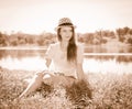 Vintage photo of relaxing young woman in nature. Retro styled po Royalty Free Stock Photo