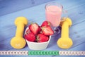 Vintage photo, strawberries, milkshake, dumbbells and centimeter, healthy and sporty lifestyle