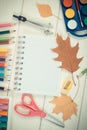 Vintage photo, School accessories and orange leaves on white boards, back to school concept Royalty Free Stock Photo