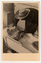 Vintage photo shows father with baby girl in the pram (baby carriage), circa 1940 Royalty Free Stock Photo