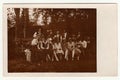 Vintage photo shows group of people in nature, circa 1930s