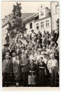 Vintage photo shows group of people on vacation.