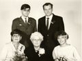 Vintage photo shows wedding guests. One of them wears an army uniform. Retro black and white photography. Circa 1980. Royalty Free Stock Photo