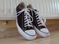 Old pair of tennis shoes - old trainers black and white photograph Royalty Free Stock Photo