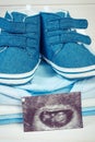 Vintage photo, Ultrasound scan of baby and clothing for newborn baby Royalty Free Stock Photo