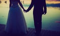 Vintage photo of wedding couple silhouettes in outdoor Royalty Free Stock Photo