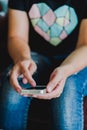 Vintage photo of woman using mobile smart phone in coffee shop. Royalty Free Stock Photo