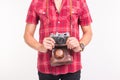 Vintage, photographer and people concept - retro camera in man`s hands over the white background Royalty Free Stock Photo