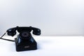 Vintage piano black telephone with classic rotary dial isolated Royalty Free Stock Photo