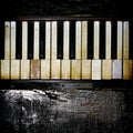A Vintage Piano Keyboard With Charred Wood Accent. Royalty Free Stock Photo