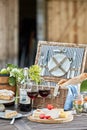 Vintage picnic hamper with wine, cheese and tart Royalty Free Stock Photo