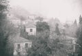 Vintage picture. Fog above traditional houses in Milies village on mountain Pelion.Greece.