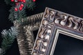 Two wooden picture frames on black background. Christmas decor.