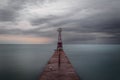 Vintage pier leading out into Lake Michigan on cloudy overcast day Royalty Free Stock Photo