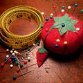 Vintage pin cushion and tape measure Royalty Free Stock Photo