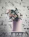 Vintage pink cans with flowers, toned blurred image, selective f