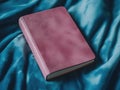 Vintage Pink Leather-Bound Book on a Bedspread Royalty Free Stock Photo