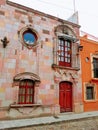 Vintage pink and orange building Mexican streetscape in san miguel allende mexico Royalty Free Stock Photo