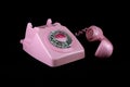 Vintage Pink Telephone on a Black Background Royalty Free Stock Photo