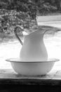 Vintage pitcher and bowl on an outdoor table