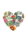 Vintage plants and flowers postage stamps from around the world in the shape of a heart.