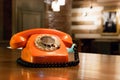 Vintage orange telephone in a bar. Royalty Free Stock Photo