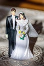 Vintage plastic wedding cake topper of bride and groom Royalty Free Stock Photo