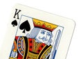 Vintage playing card showing a close up of the king of spades.