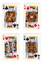 Vintage playing cards showing four kings.