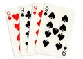 Vintage playing cards showing a hand of four nines.