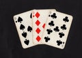Vintage playing cards showing a hand of three nines. Royalty Free Stock Photo
