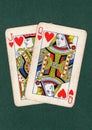 Vintage playing cards showing a jack and queen of hearts. Royalty Free Stock Photo