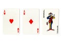 Vintage playing cards showing a pair of aces and a joker. Royalty Free Stock Photo