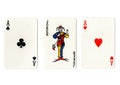 Vintage playing cards showing a pair of aces and a joker. Royalty Free Stock Photo