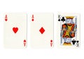 Vintage playing cards showing a pair of aces and a king. Royalty Free Stock Photo